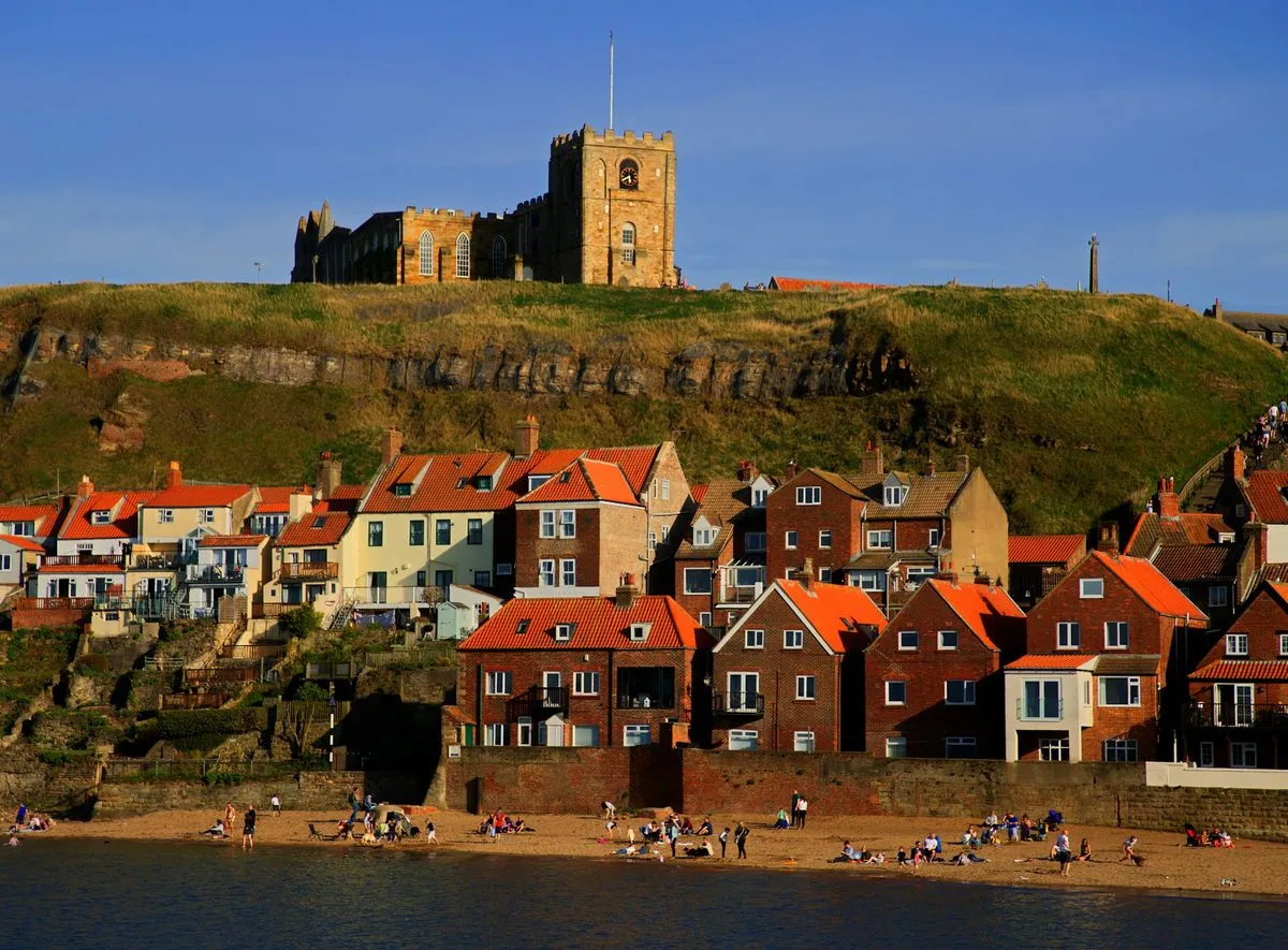 St Mary’s Church on the cliff above the red-roofed houses and beach of Whitby’s east side.