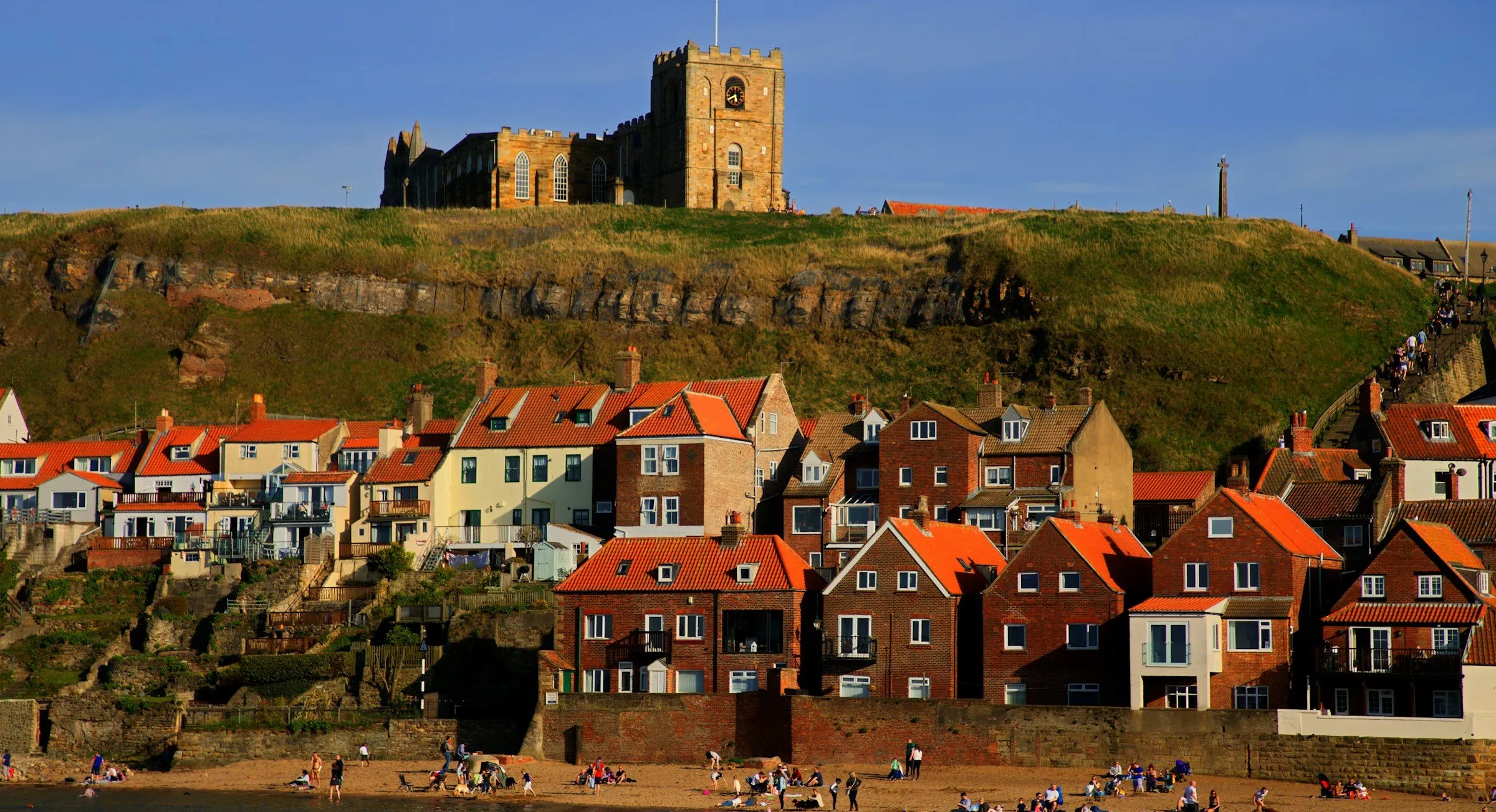 St Mary’s Church on the cliff above the red-roofed houses and beach of Whitby’s east side.